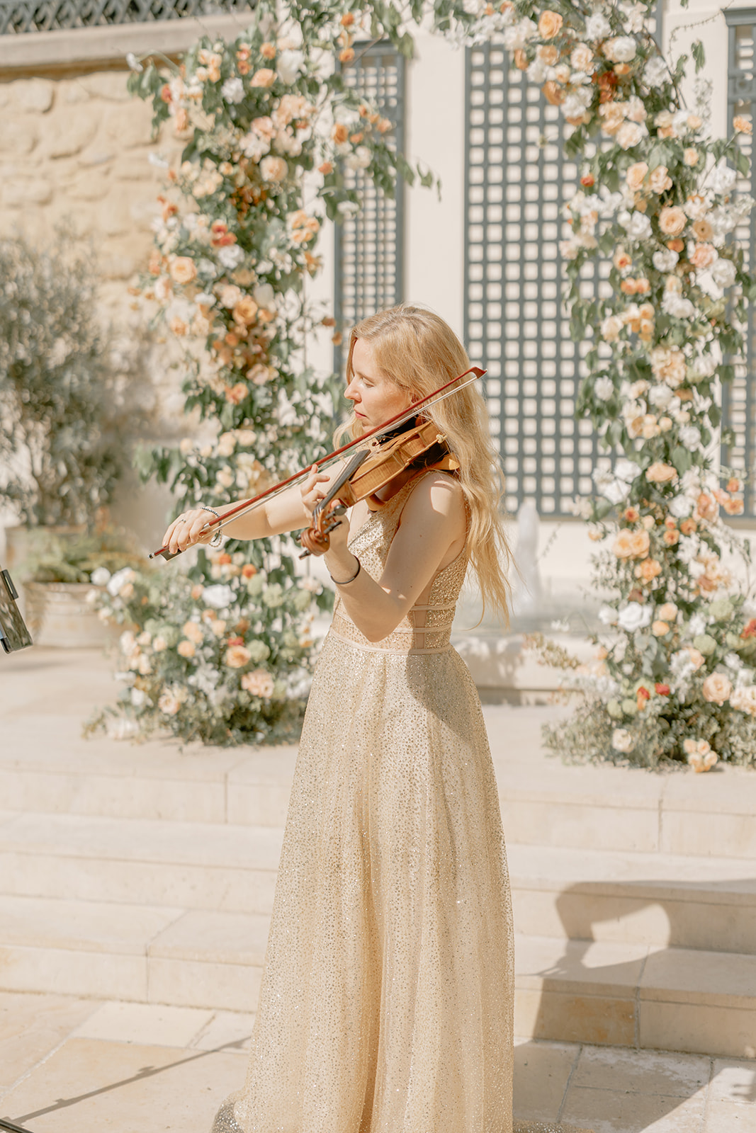 violonist, parisian wedding, floral arch